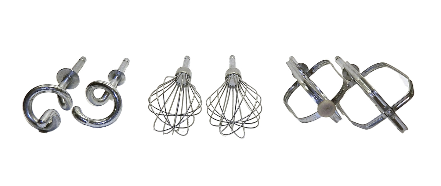 Set of metal kitchen attachments including a beater, whisk, and dough hook on a white background