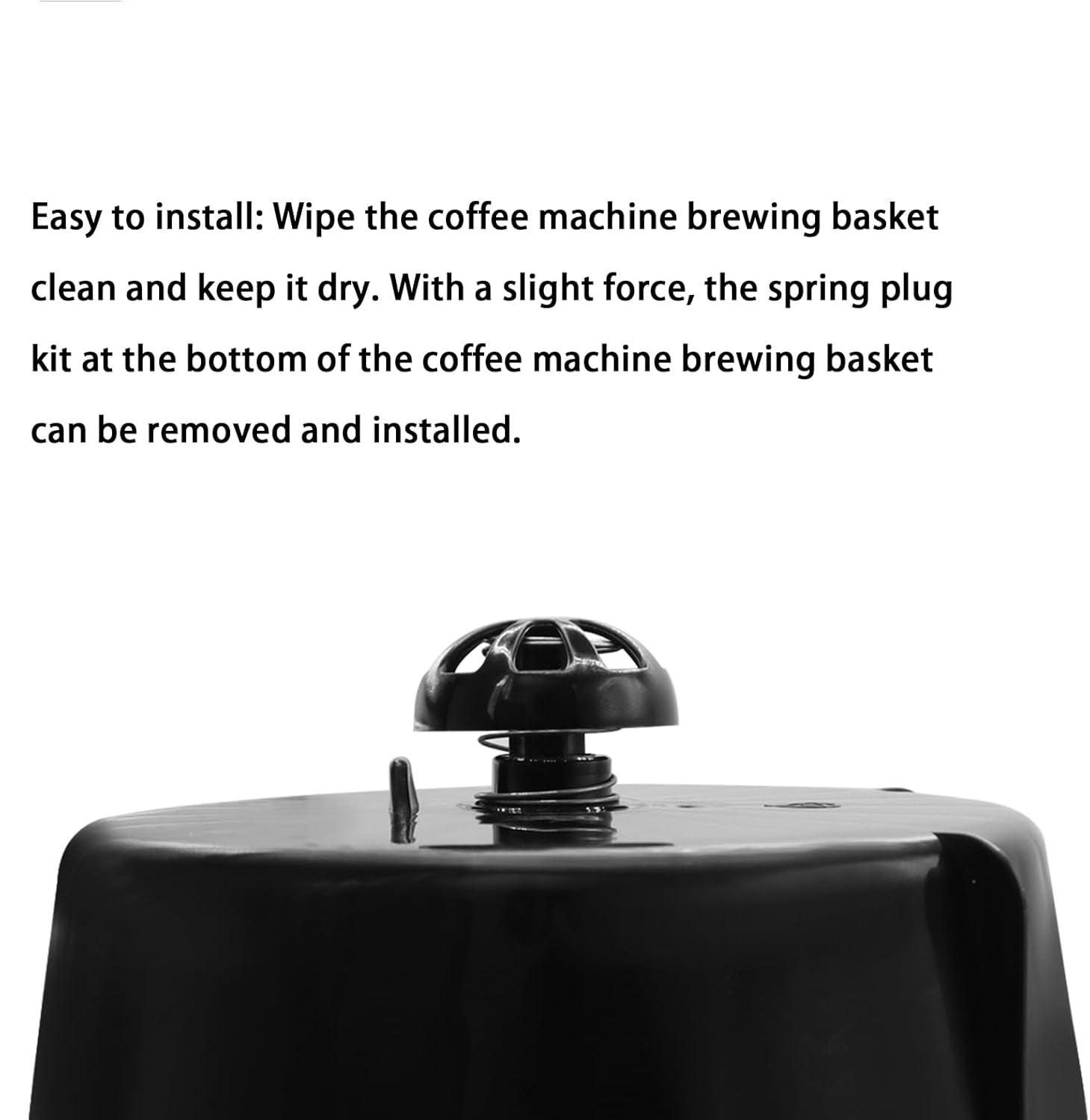 Instructional text on a white background explaining how to install a spring plug kit into a coffee machine brewing basket, with a close-up photo of the black plastic basket and spring plug component at the bottom.