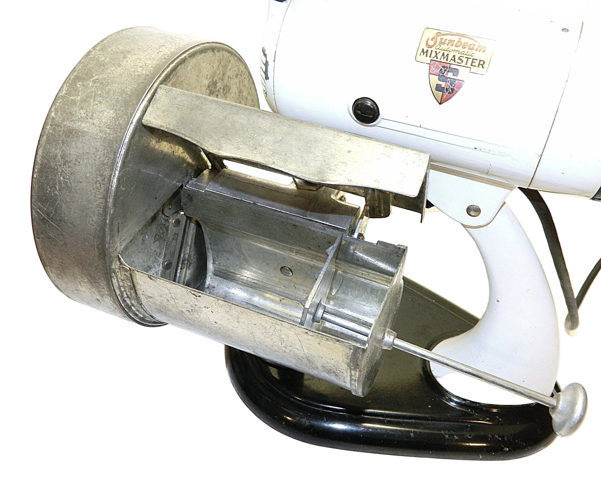 Close-up of a vintage meat slicer with 'Sunbeam Maxmaster' branding on a white background.