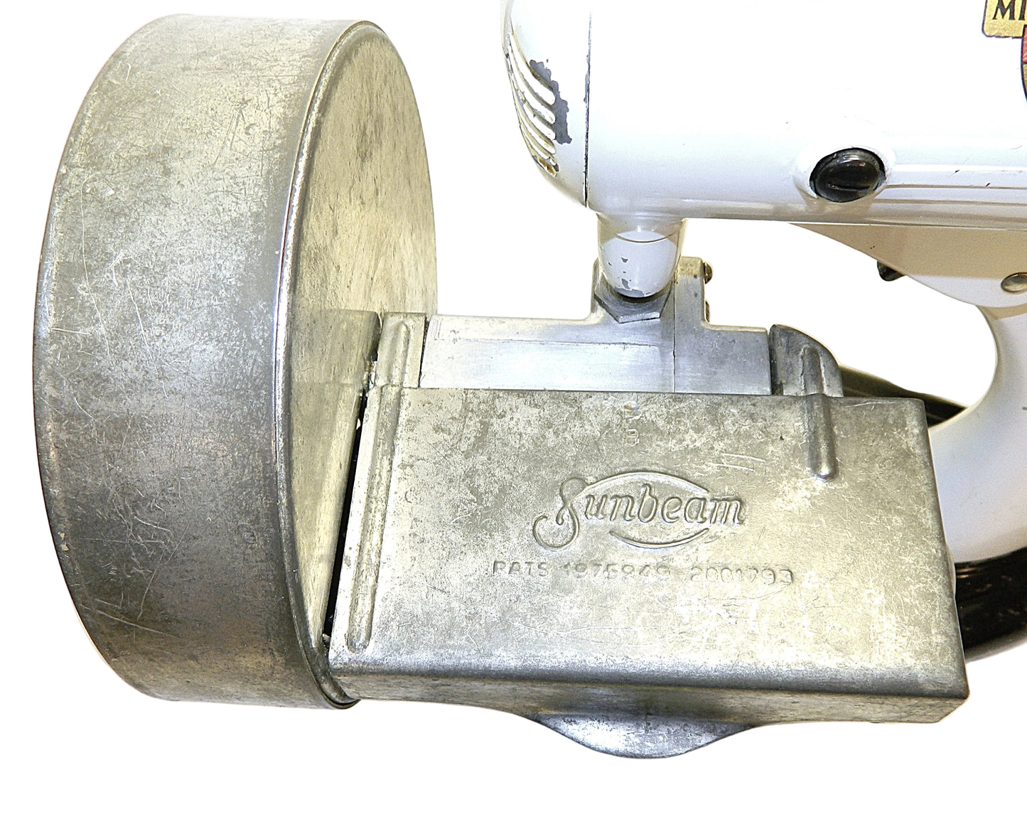 Metallic appliance part with 'Sunbeam' branding on a white background