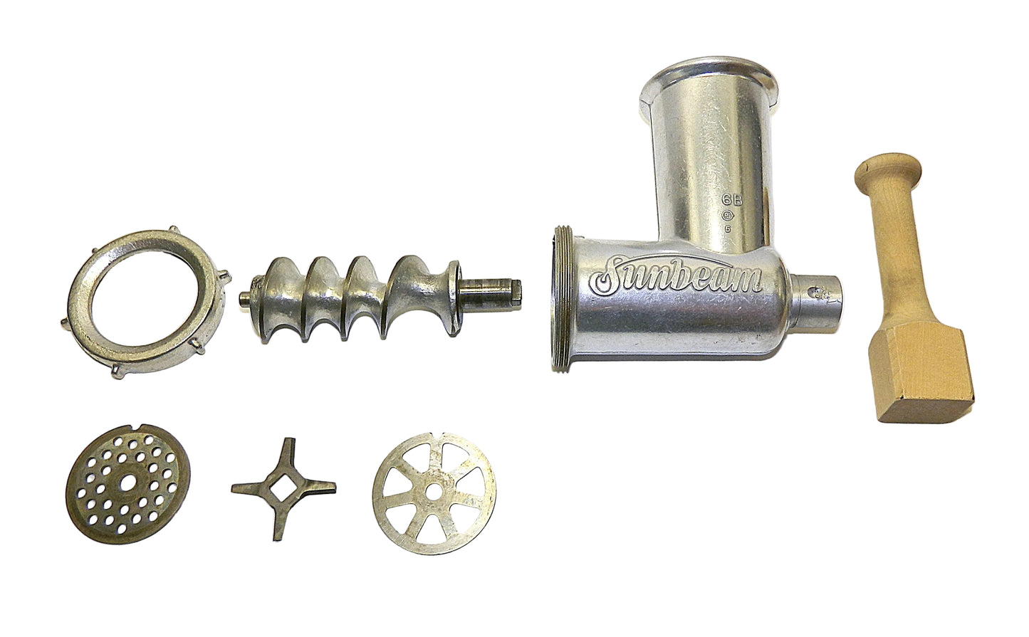 Sunbeam meat grinder with various parts on a white background