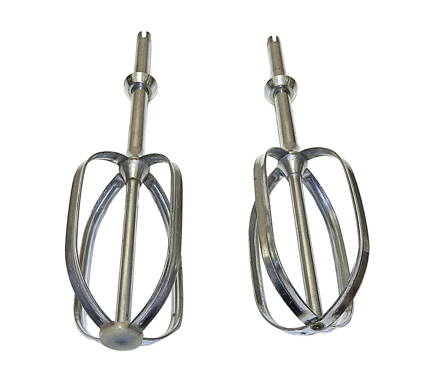 Two metal mixing beaters on a white background