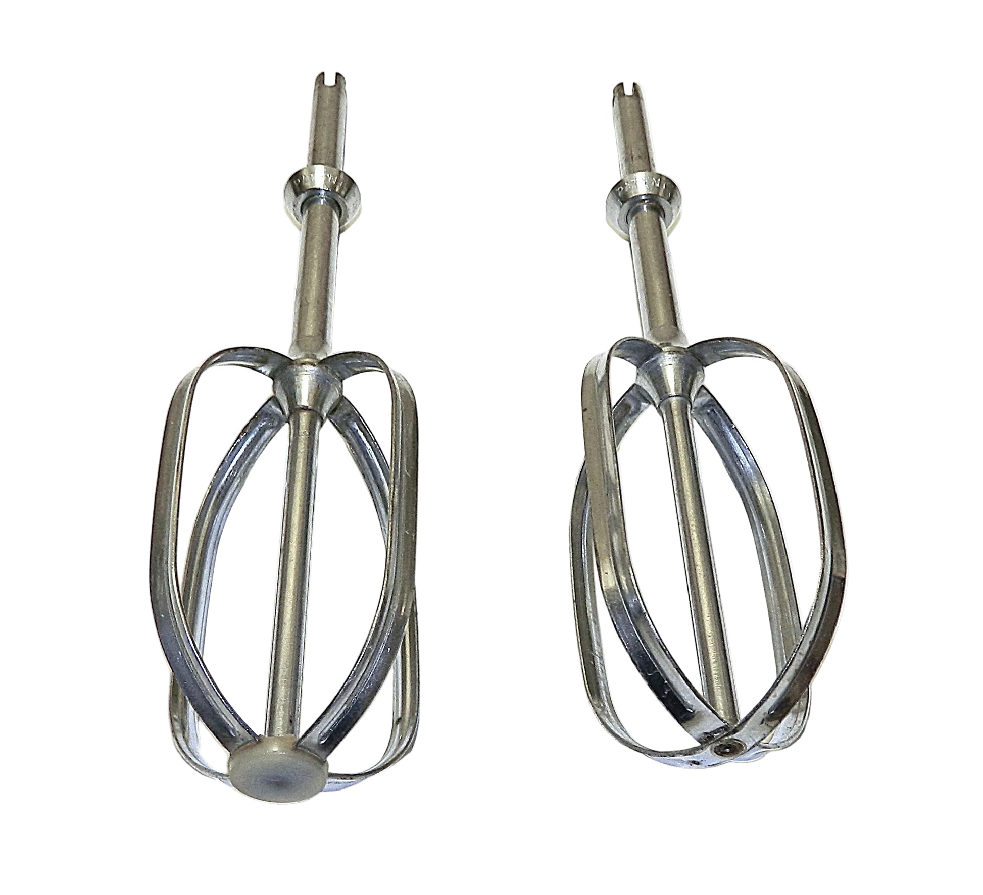 Two metal mixing beaters on a white background