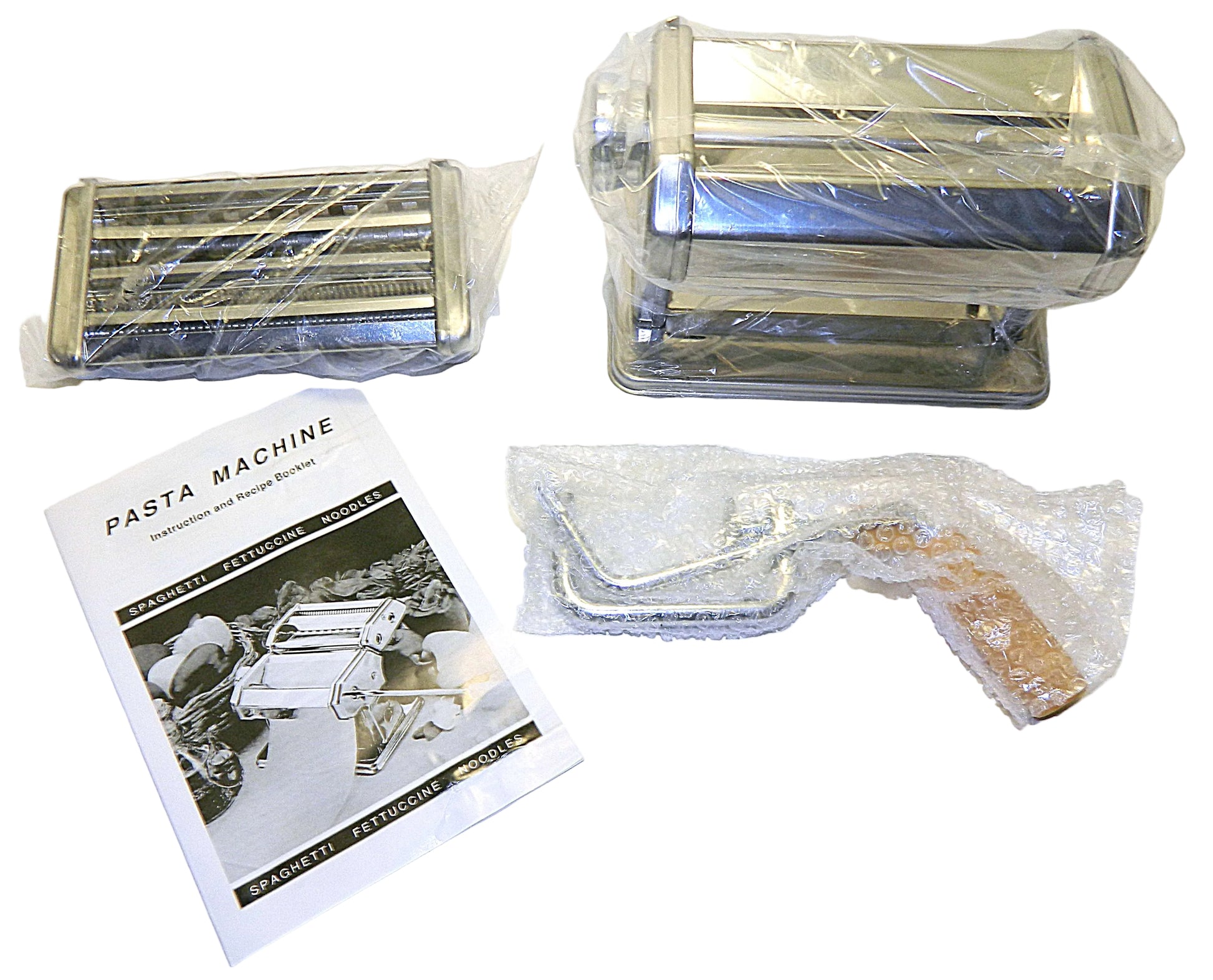 Pasta machine with packaging and a manual on a white background