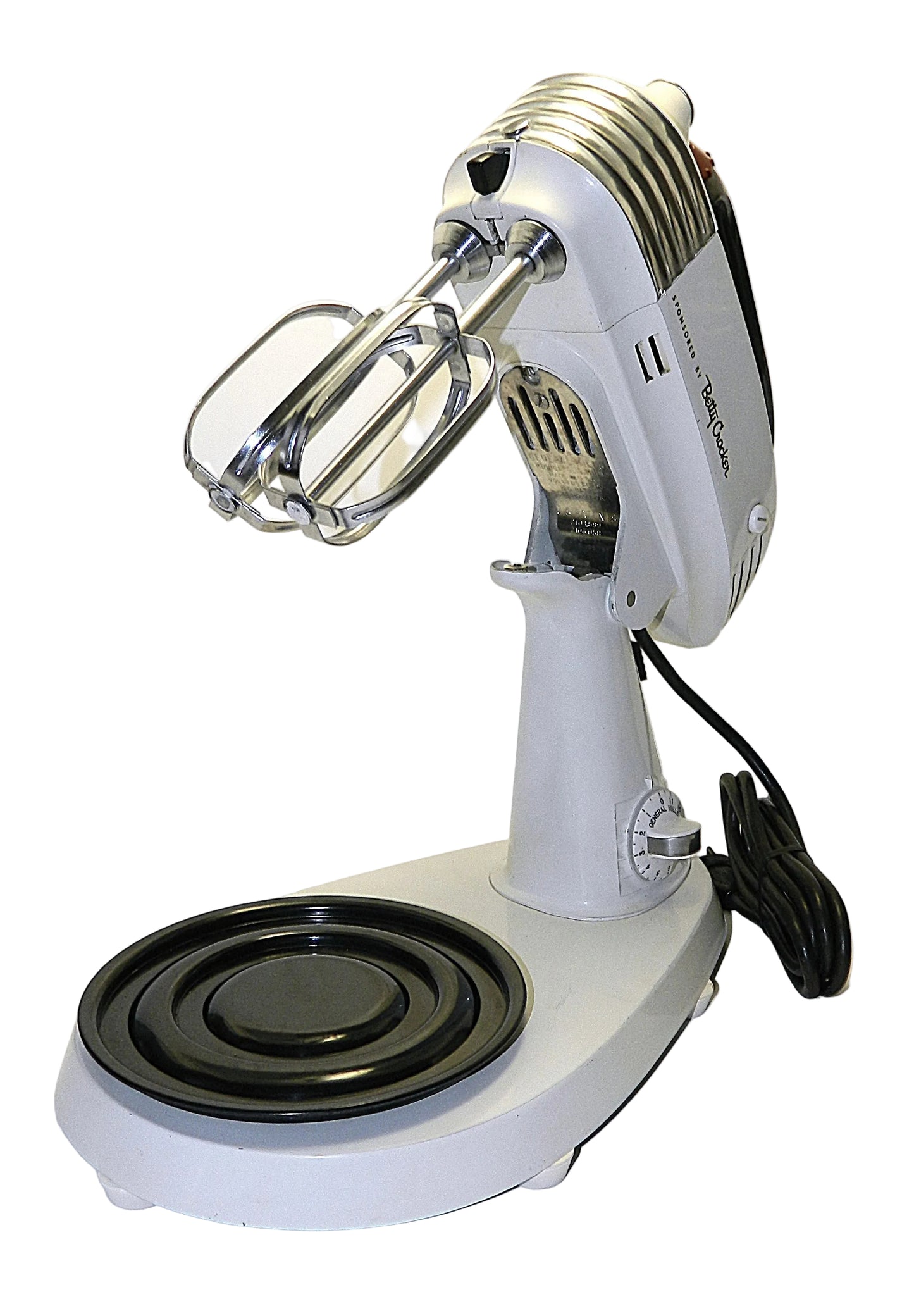Vintage-style stand mixer with whisk attachment on a white background