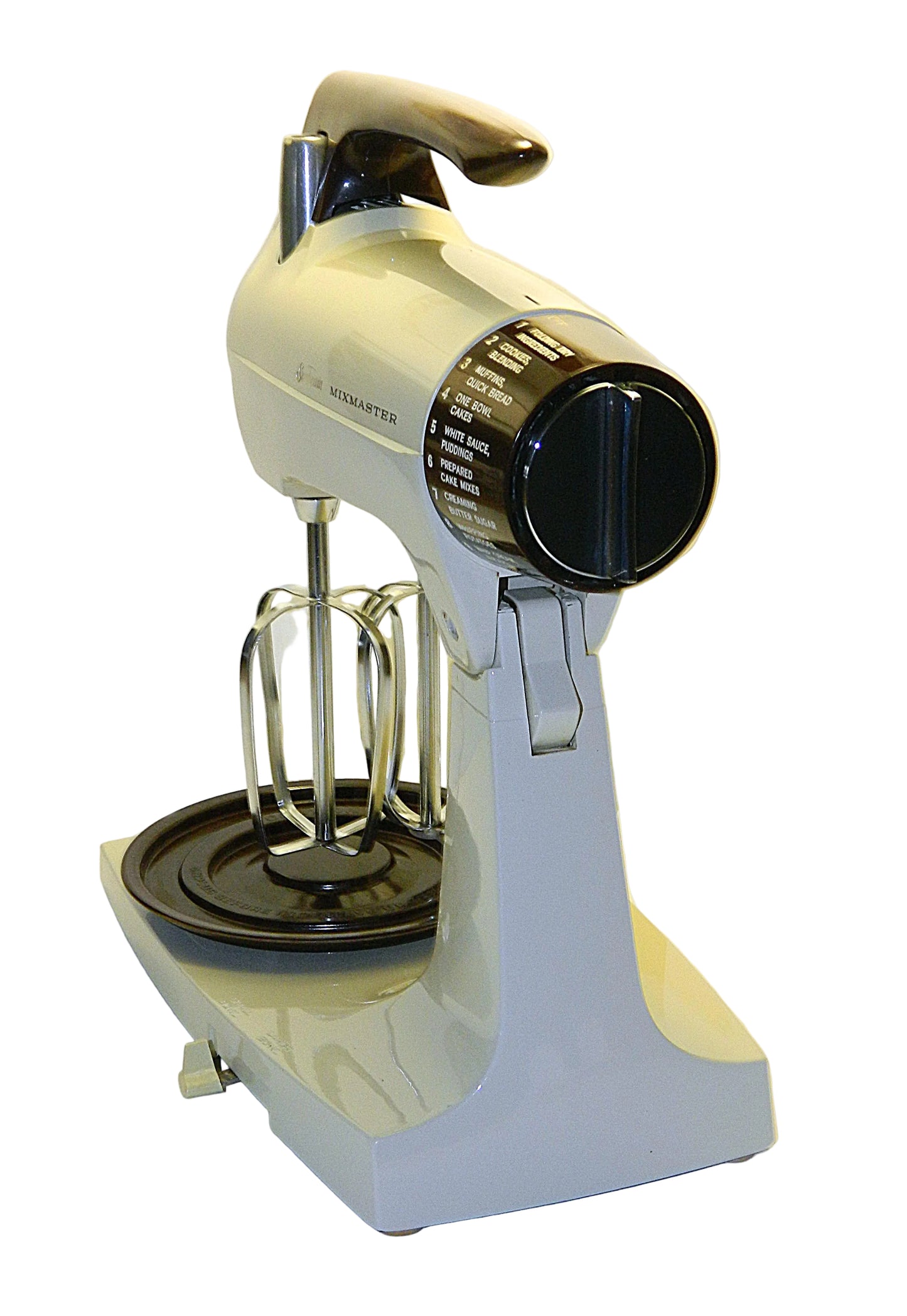 White stand mixer with attachments on a white background