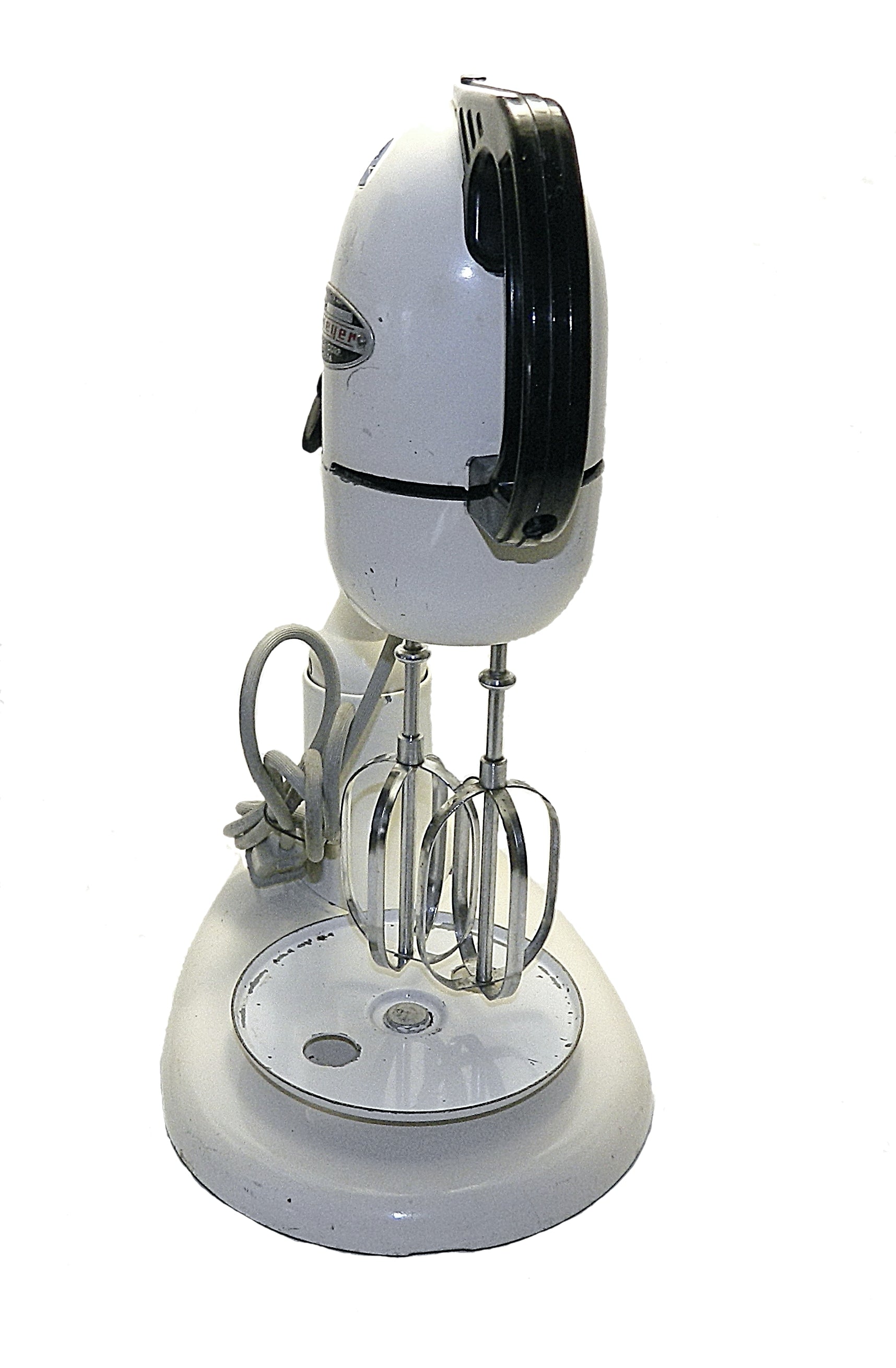 White stand mixer with attachments on a white background