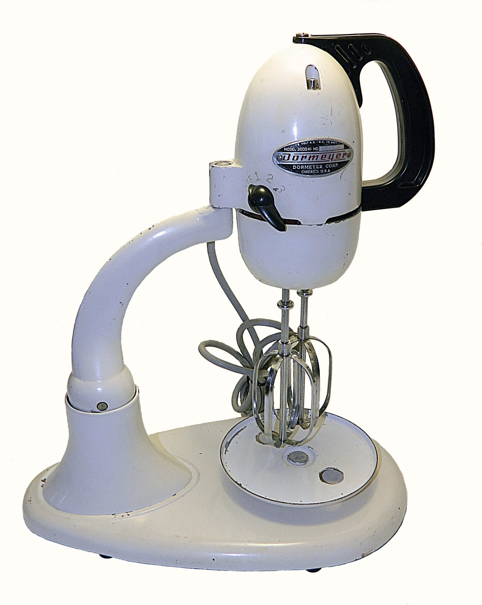 Vintage white stand mixer with black handle on a white background