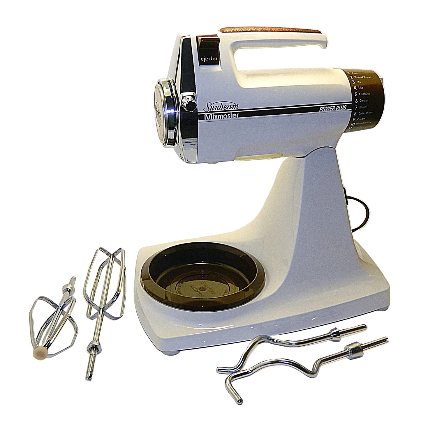 Vintage Sunbeam stand mixer with attachments on a white background