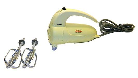 Vintage kitchen mixer with attachments on a white background