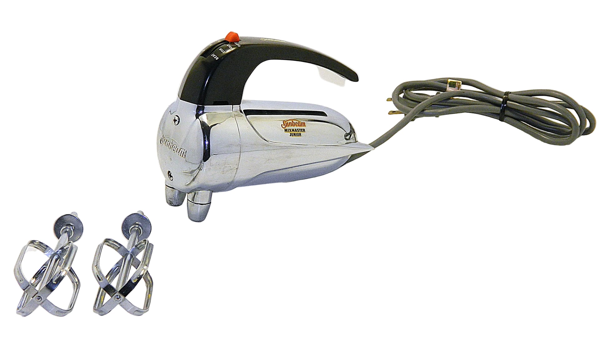 A vintage electric hand mixer with a chrome body, black handle, and gray cord, shown with two metal beaters on a white background.