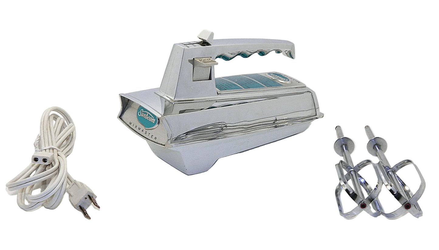 A vintage electric hand mixer with a chrome silver body and teal accents, shown with its white power cord and two metal beaters on a white background.