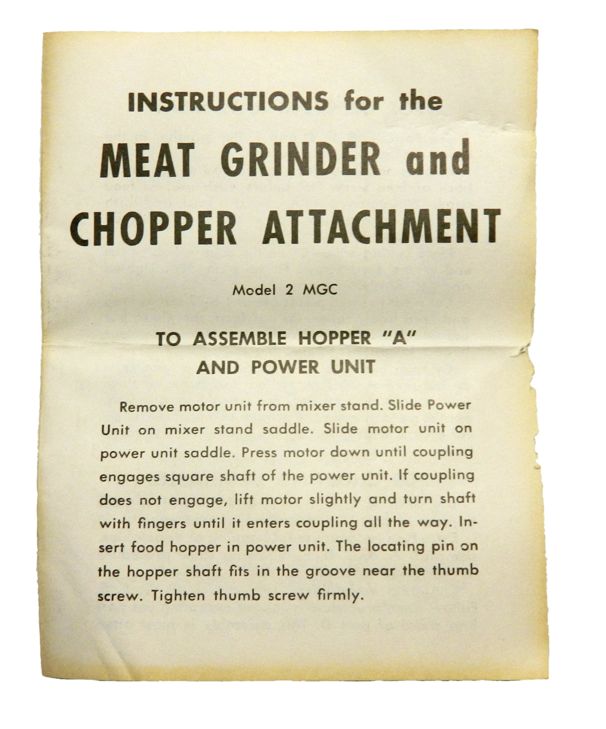 A vintage instruction sheet for a meat grinder and chopper attachment, showing assembly instructions on aged, yellowed paper against a white background.