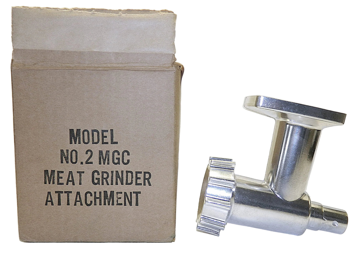 A stainless steel meat grinder attachment shown next to its original cardboard box, which is labeled 'MODEL NO.2 MGC MEAT GRINDER ATTACHMENT'.
