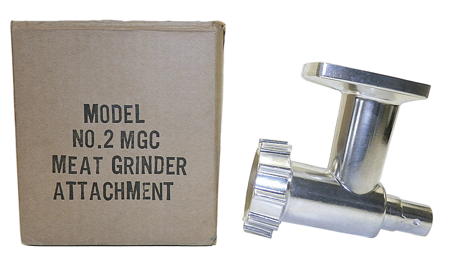 A polished metal meat grinder attachment shown next to its original brown cardboard box labeled 'MODEL NO.2 MGC MEAT GRINDER ATTACHMENT' on a white background.