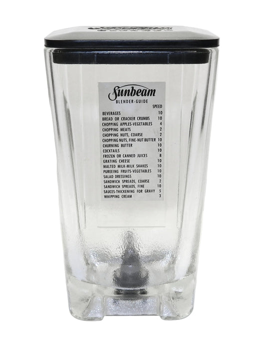 A clear glass blender jar with a black lid and a white printed 'Sunbeam Blender Guide' label on the front, photographed against a white background.