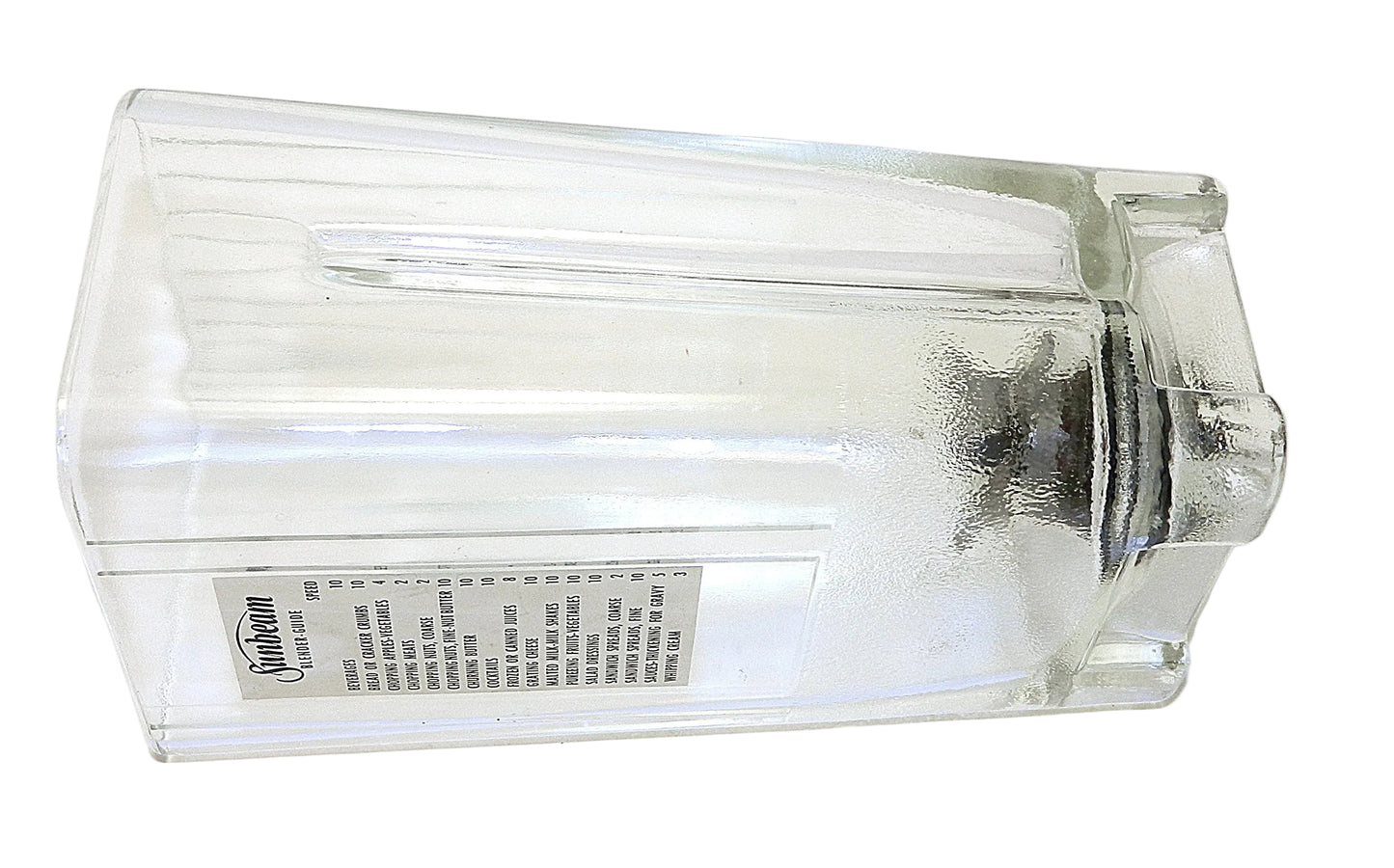 A clear glass blender jar replacement pitcher with a frosted lid, shown from a side angle on a white background. A label with the brand 'Kemper' is visible on the side.