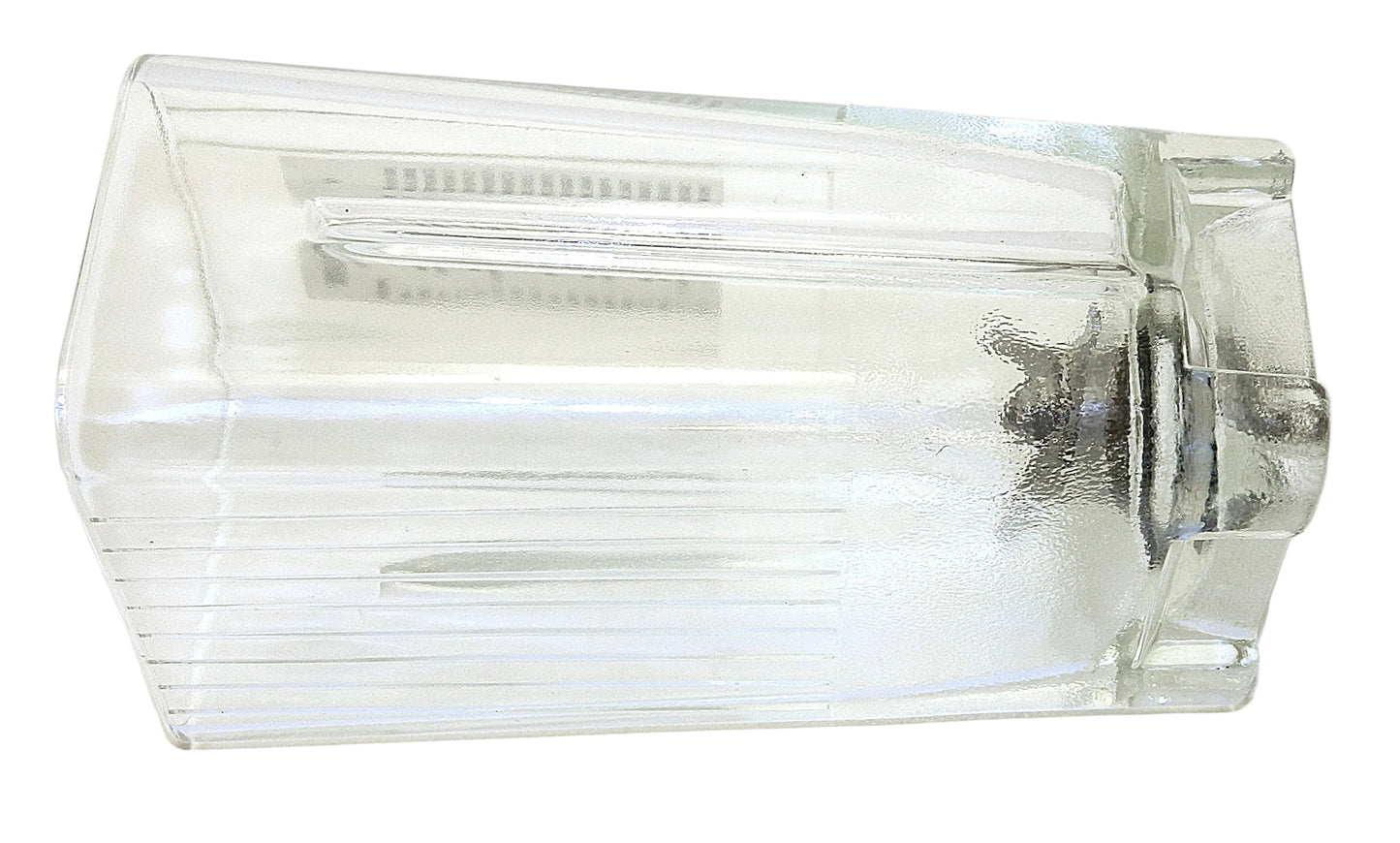 A clear glass pitcher with a ribbed exterior and a visible metal motor base inside, photographed on a white background.
