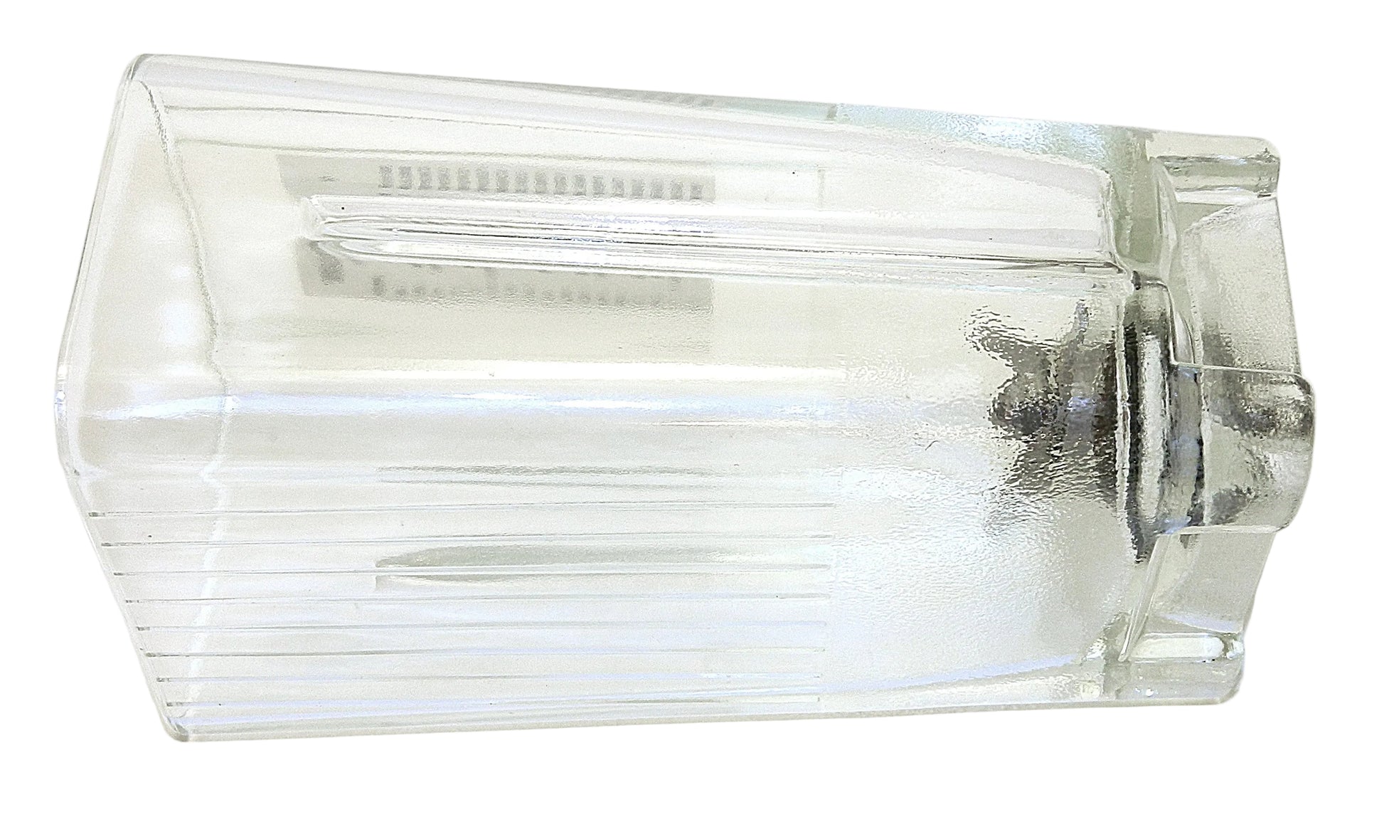 A clear glass pitcher with a ribbed exterior and a visible metal motor base inside, photographed on a white background.