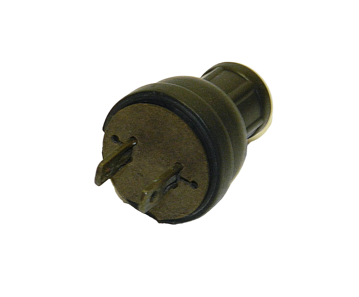 A vintage military-style plastic plug or connector with two pins, shown on a plain white background.