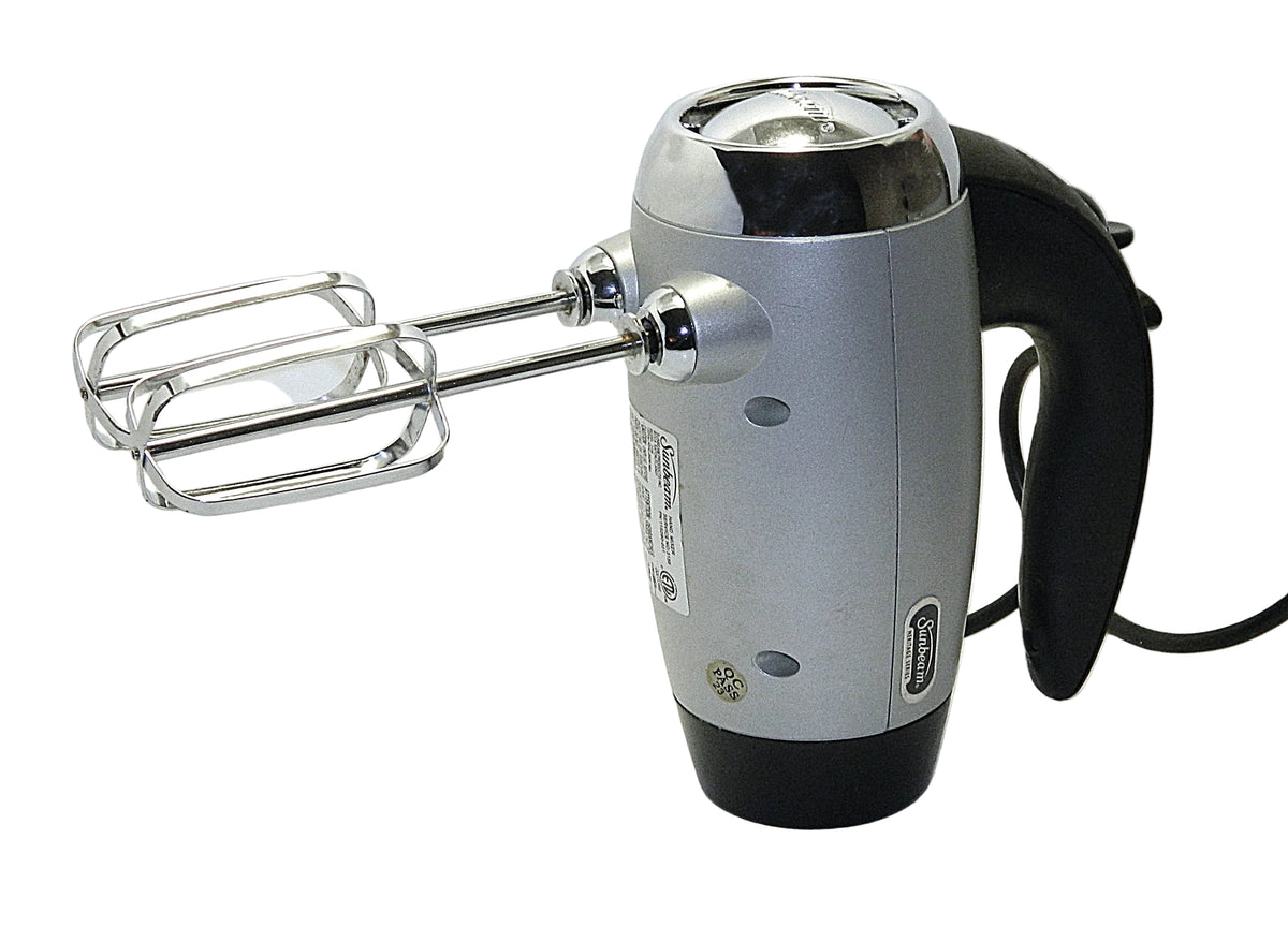 A vintage-style hand mixer with a silver and black body, dual metal beaters, and a black cord, photographed on a plain white background.