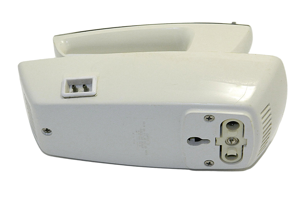 A vintage cream-colored electric hand mixer shown from the back, displaying its power cord entry, switch, and ventilation slots on a white background.