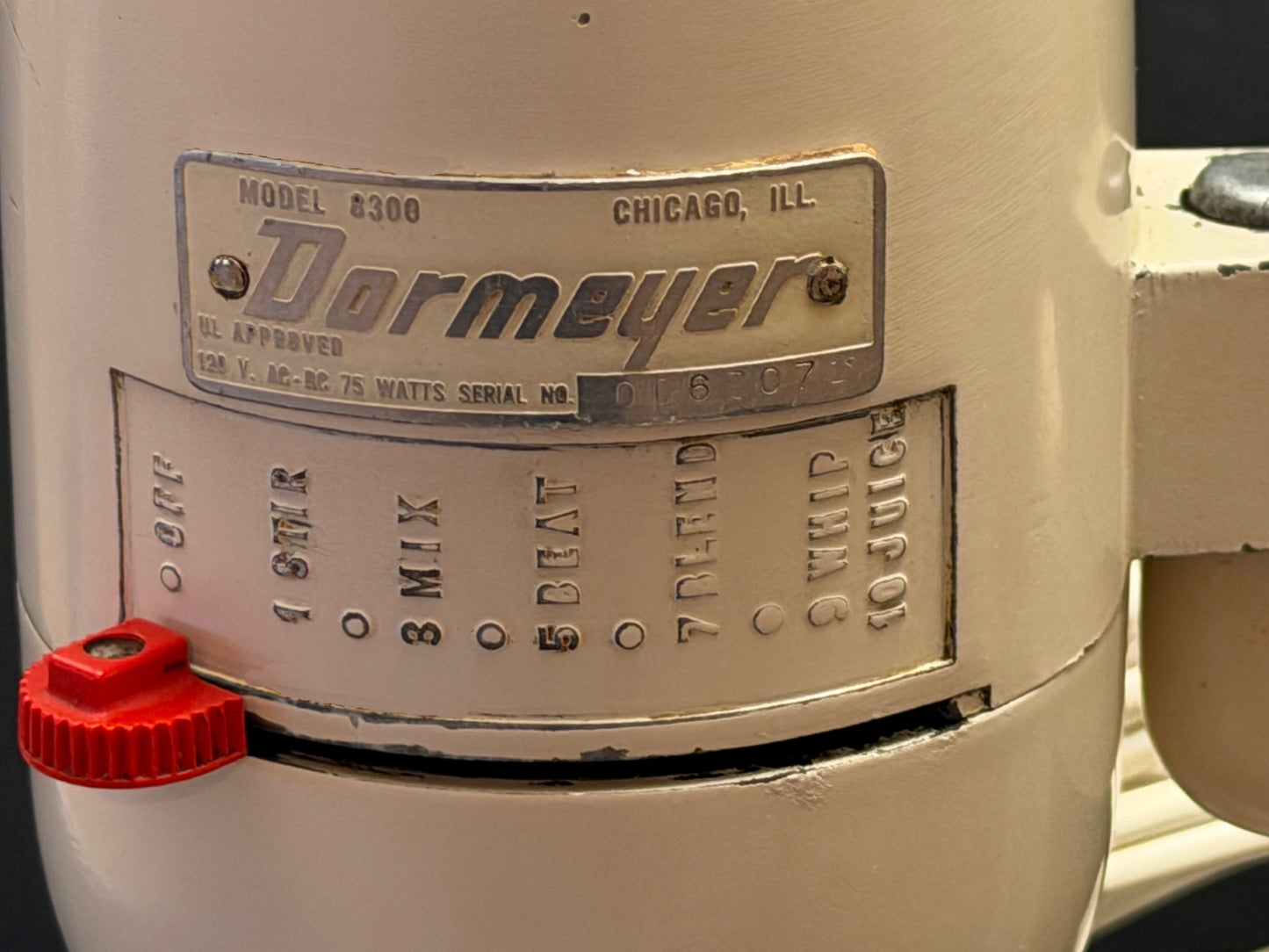 Dormeyer mixer with control dial and red knob on a beige background